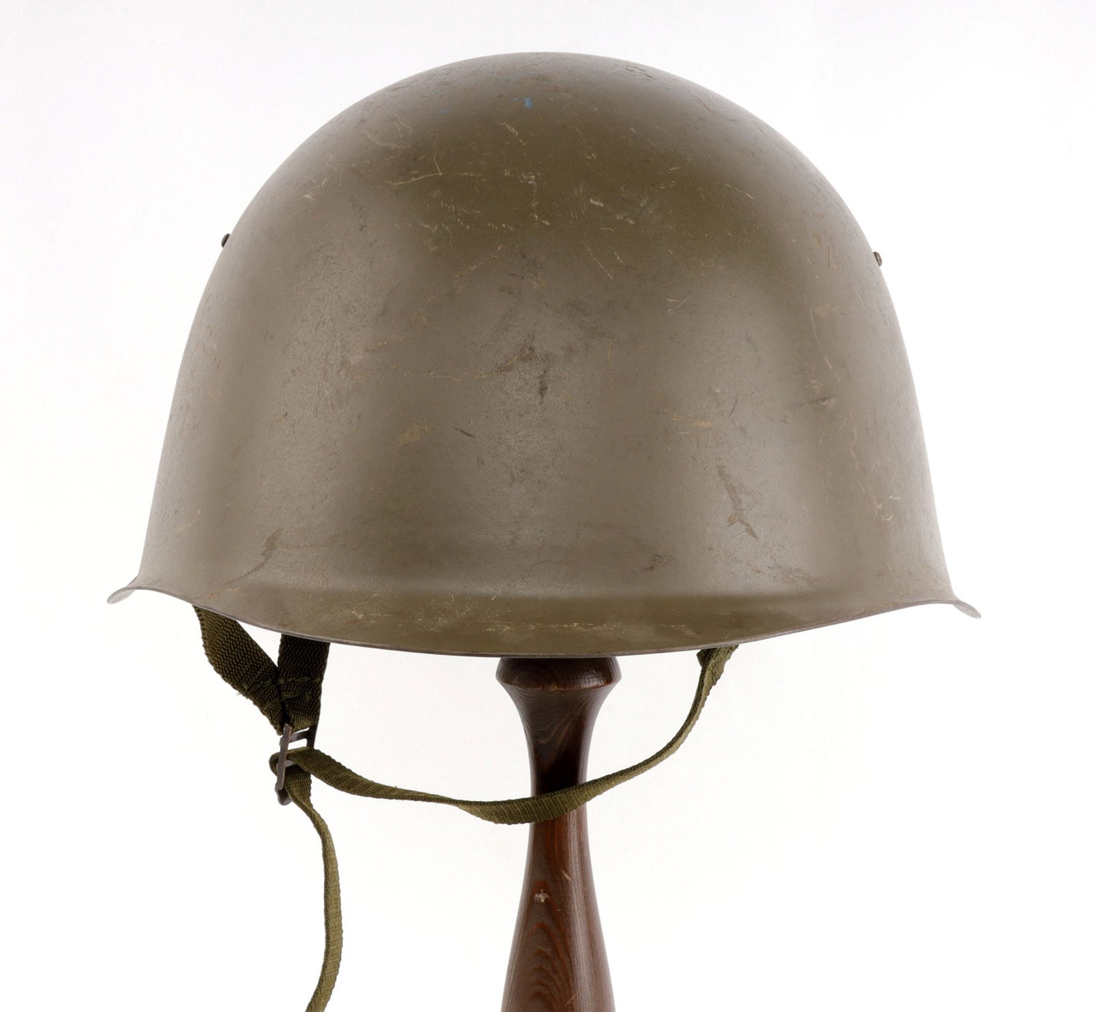 COLD WAR CZECH ARMY VZ53 COMBAT HELMET: Czech Army M53 steel combat helmet with padded leather liner and chinstrap. Interior stamped "66" at neck and ink-stamped with crossed swords acceptance mark and "59" at visor. Very good condition.