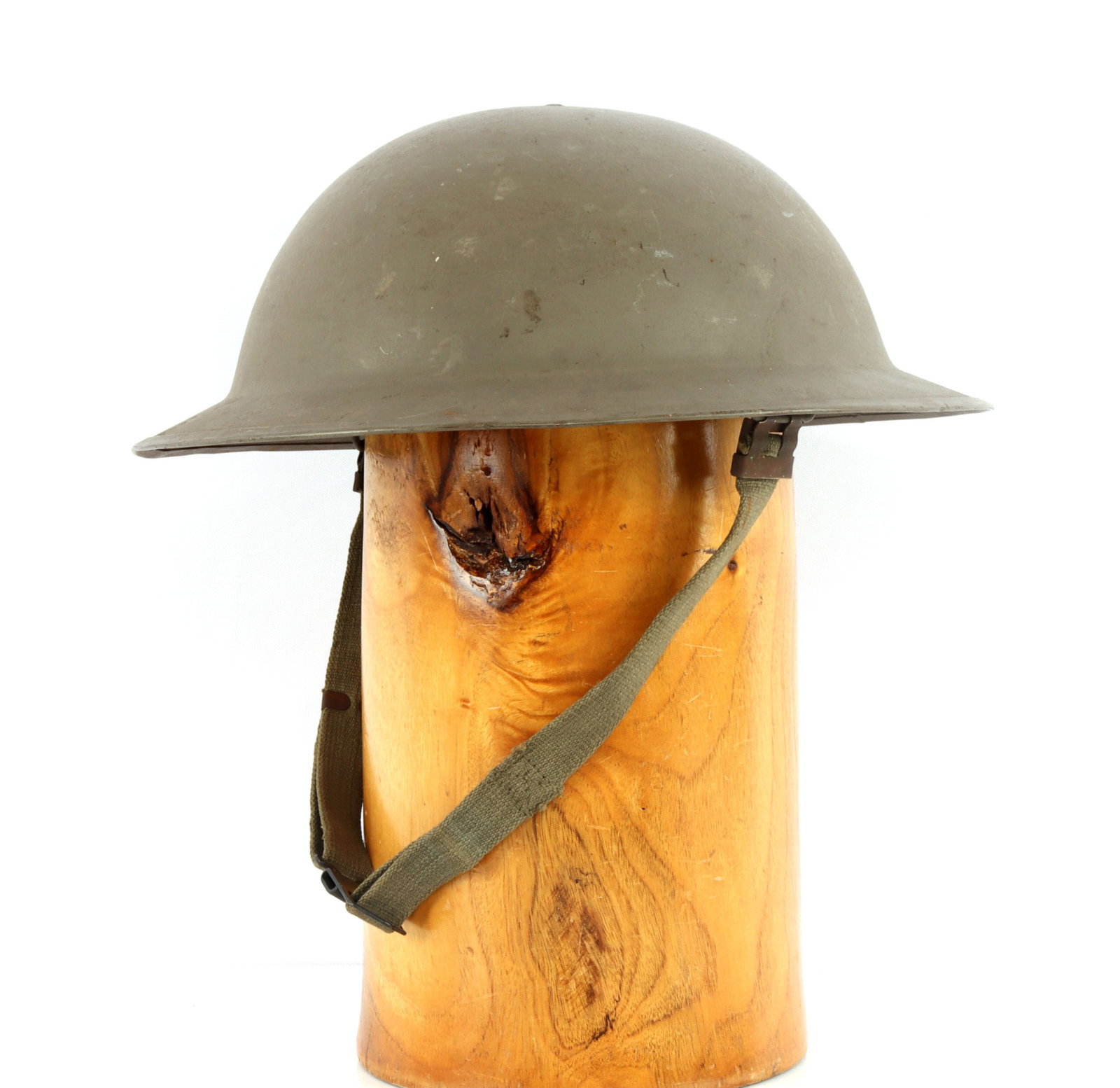 COLD WAR DUTCH VB BRODIE TYPE CIVIL DEFENSE HELMET: Complete, with liner and chinstrap. Liner marked size 54. Interior has Dutch acceptance ink-stamp. Rim marked "VB55 12SL0." Very good condition.
