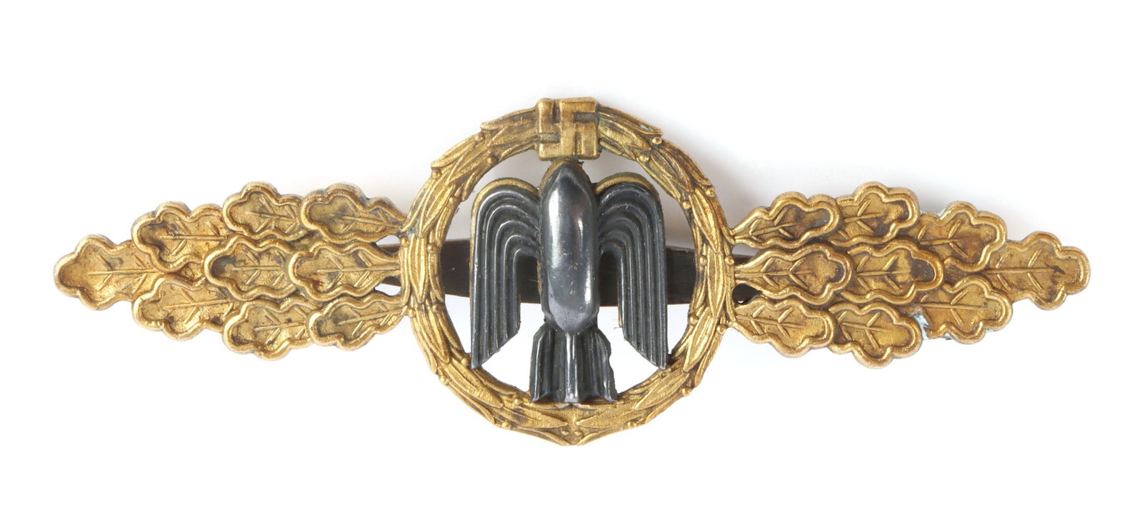 WWII GERMAN LUFTWAFFE BOMBER CLASPS: Gilt tombak constructed wreath with silvered winged bomb. Reverse is marked CE. Juncker Berlin SW68. It measures 3 inches. Very good condition.
