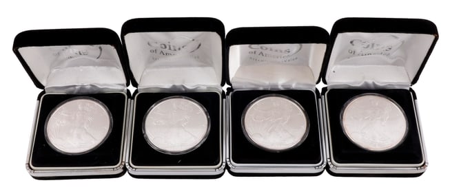 LOT OF FOUR CASED US SILVER AMERICAN EAGLES