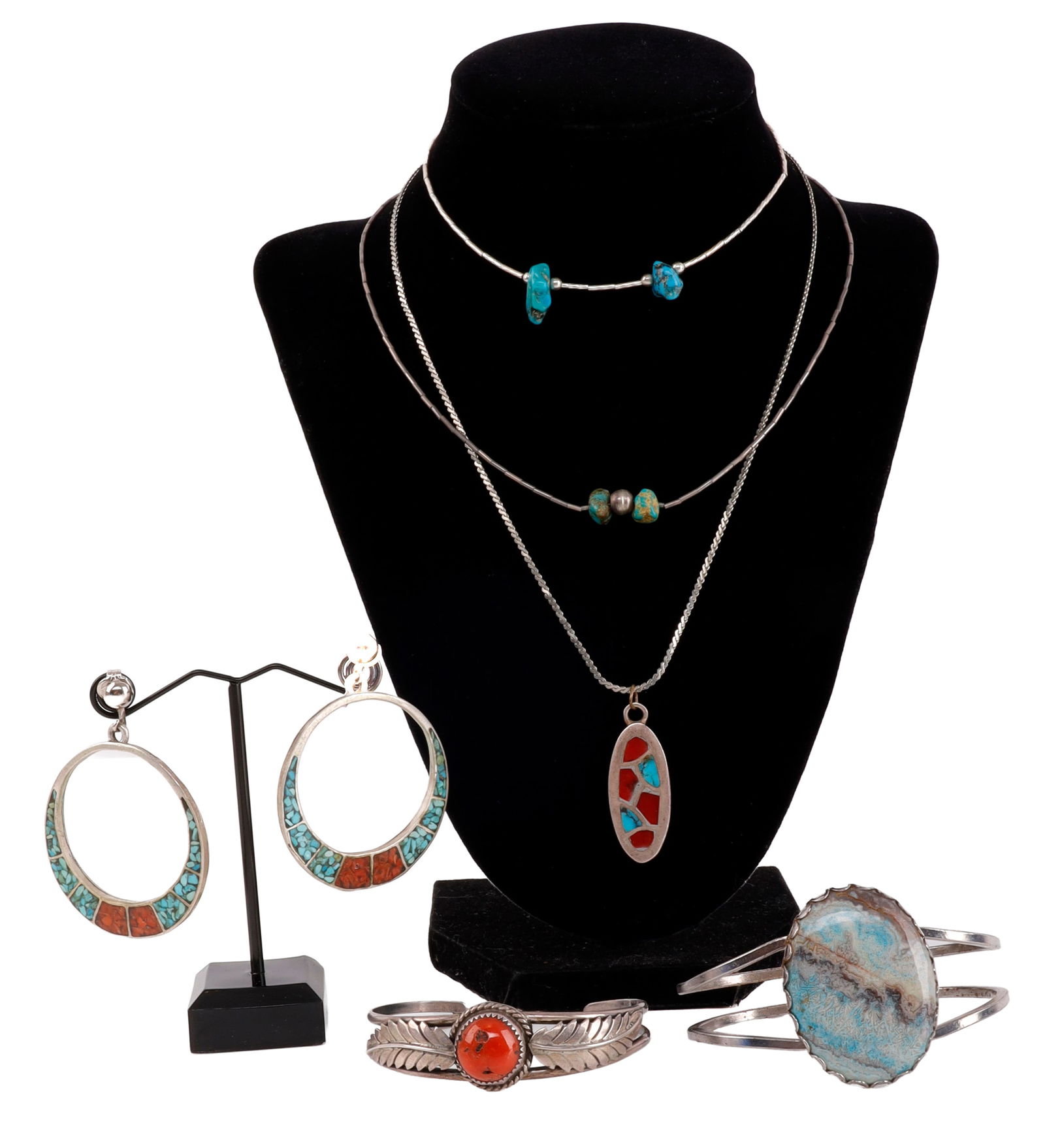 NAVAJO TURQUOISE & SILVER JEWELRY DEALERS LOT OF 8: Seven assorted Navajo silver and turquoise pieces. One anklet, two necklaces, a pendant, a ring (size 8), two cuffs, and one pair of earrings. A lovely and diverse lot of Southwest jewelry. One of the