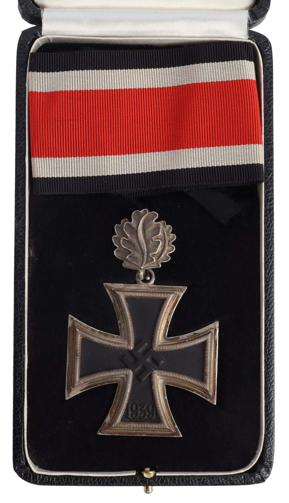 WWII GERMAN KNIGHTS IRON CROSS W OAK LEAVES: Magnetic center core, multipiece construction with silver frame. 800 marked. Oak leaves marked 800, L/12, and silber. Ribbon does not fluoresce. Cross measures 1 7/8 inches. Leaves measure 3/4 inches.
