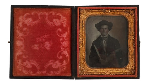 AMBROTYPE OF A BUFFALO HUNTER WITH KNIFE & GUN