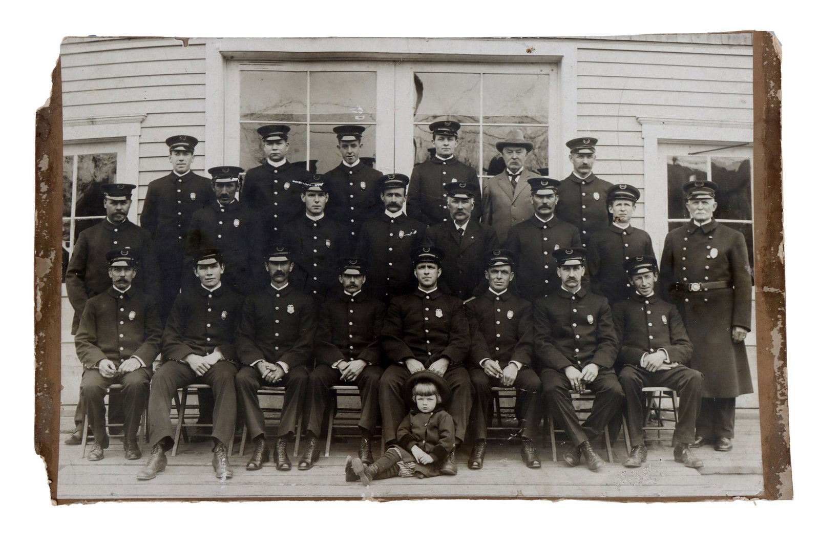 VINTAGE PHOTOGRAPH OF A POLICE SQUAD WITH CHILD: Vintage photograph of a police squad posing with a young girl. 20 X 12.5 inches. Very good, original condition.