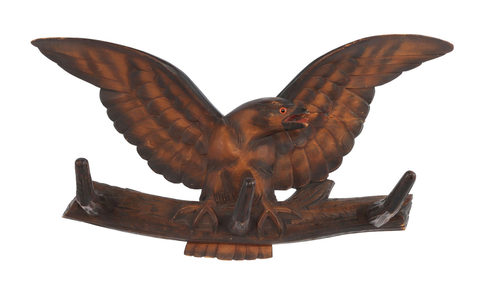 CARVED WOODEN EAGLE COAT RACK: A nicely carved depiction of an eagle in wood. One back mount needs to be replaced. 14 X 8 inches. Very good, original condition.