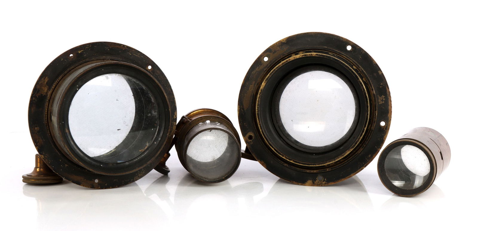 LOT OF 4 ANTIQUE BRASS CAMERA LENSES 19TH CENTURY: One Bausch and Lomb 14 3/4 inch and one with no name. Mostly clear optics.