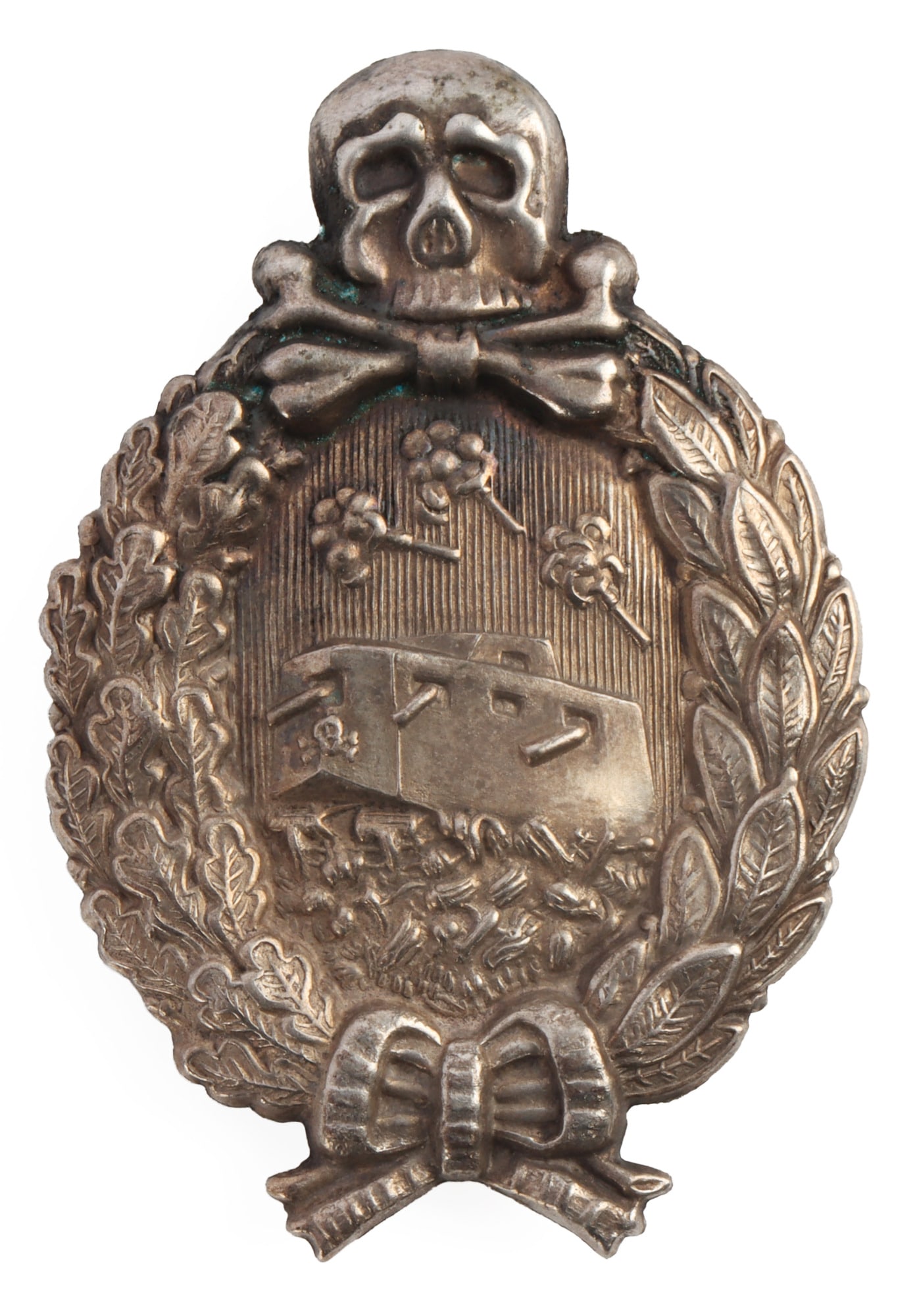 WWI IMPERIAL GERMAN PANZER TANK BADGE: Hollow type with plate back. Vent hole at the top. Screwback clam shell type. Silvered metal. Very good condition. Measures 2 1/2 inches. This lot has a reserve.
