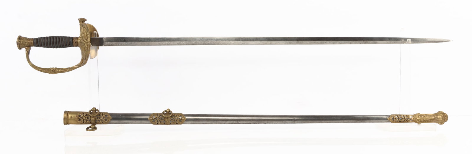 US CIVIL WAR ETCHED & INSCRIBED OFFICER SWORD: An officer's infantry saber that has been etched and inscribed on the guard by Clauberg of Solingen. The guard marks it as a gift to 'Lieutenant Peter J. Quinn,' and dates the presentation to 1880. A 