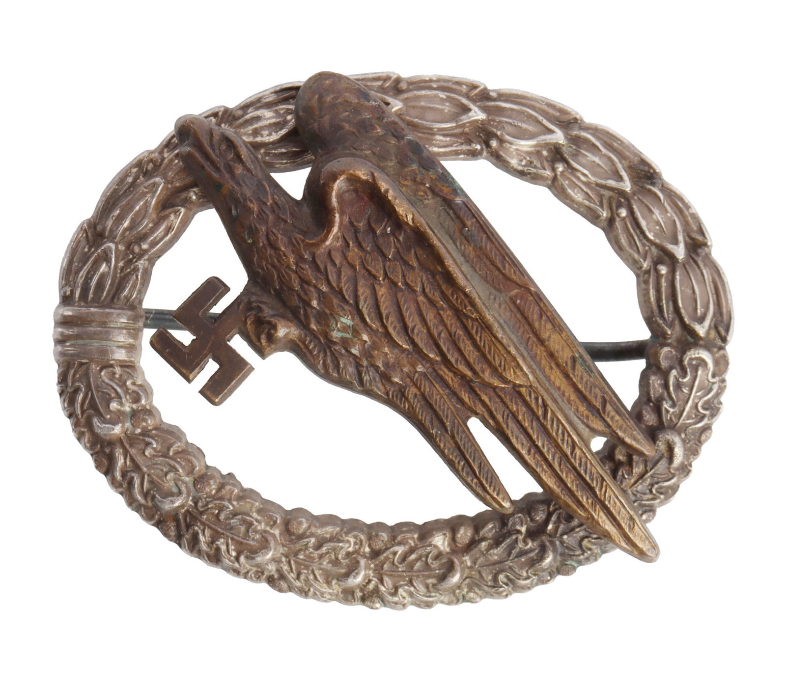 WWII GERMAN THIRD REICH PARATROOPER BADGE: A parachutist badge of the German Third Reich. A Luftwaffe eagle carrying a swastika, over a wreath of oak leaves. C. E. Juncker marked. C clasp. Gilt has largely worn off. A little over 2 inches in d