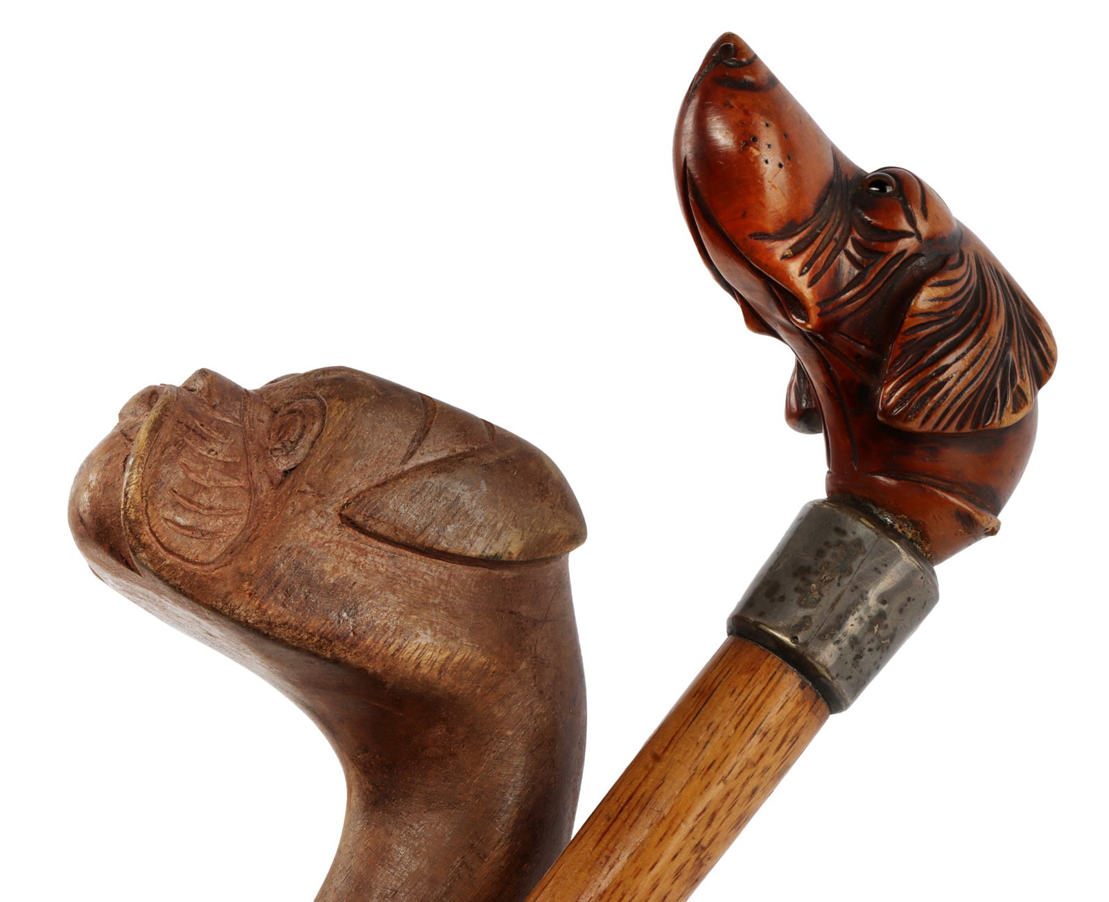 ANTIQUE WOODEN DOG HANDLE CANES LOT OF 2: Wooden cane with Lyon Maker Sterling collar and a handle featuring a dog face design and glass eyes. Measures 33 3/4 inches. Other wooden cane also has a dog faced handle with no collar and carved woo