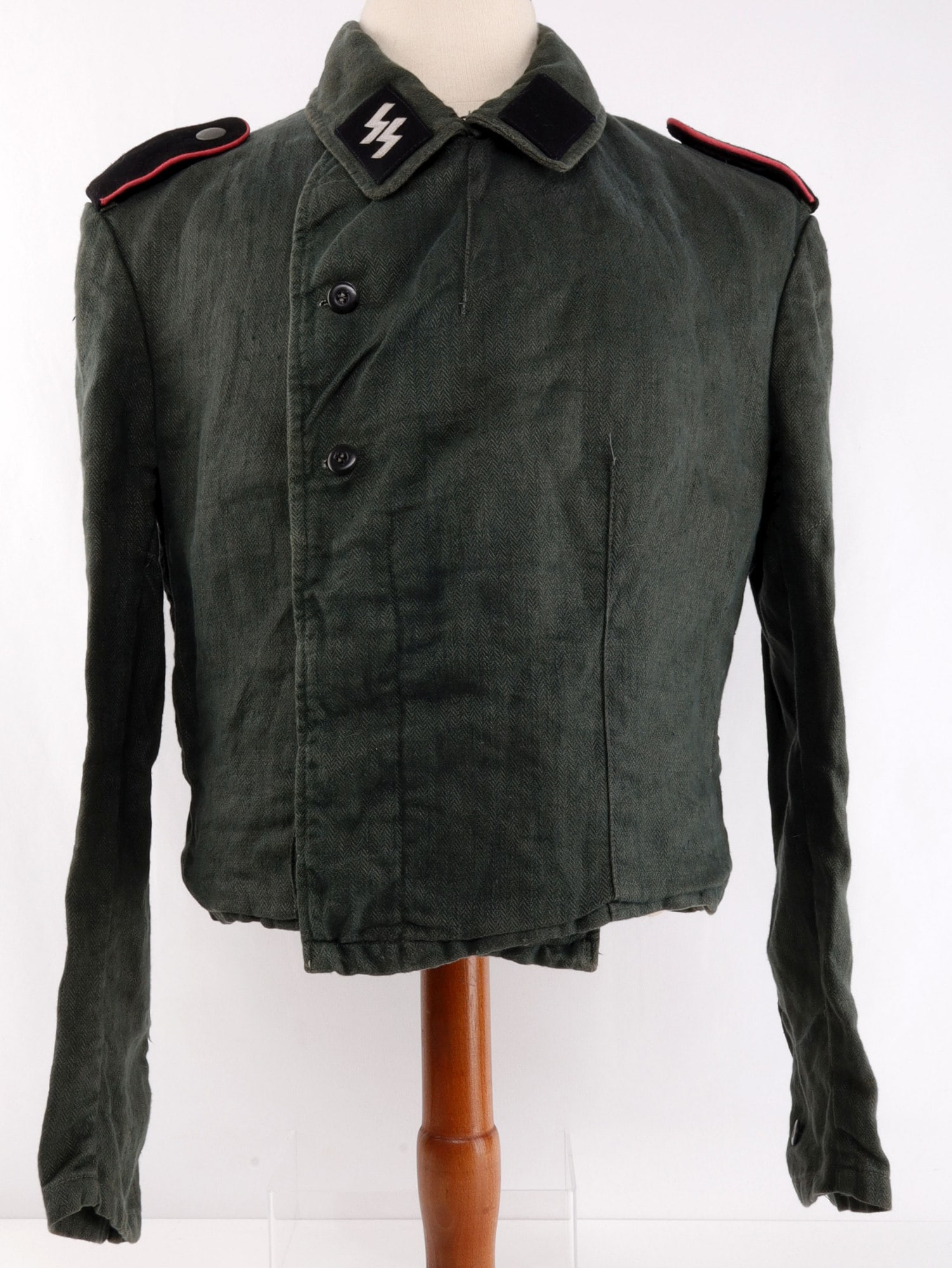 WWII GERMAN WAFFEN-SS ASSAULT GUNNER HBT WRAP: Waffen-SS Sturmgeschutze summer uniform tunic or "panzer wrapper." Grey-green herringbone twill fabric with liner of pale green herringbone silk. Liner has four (4) interior pockets and suspender stra