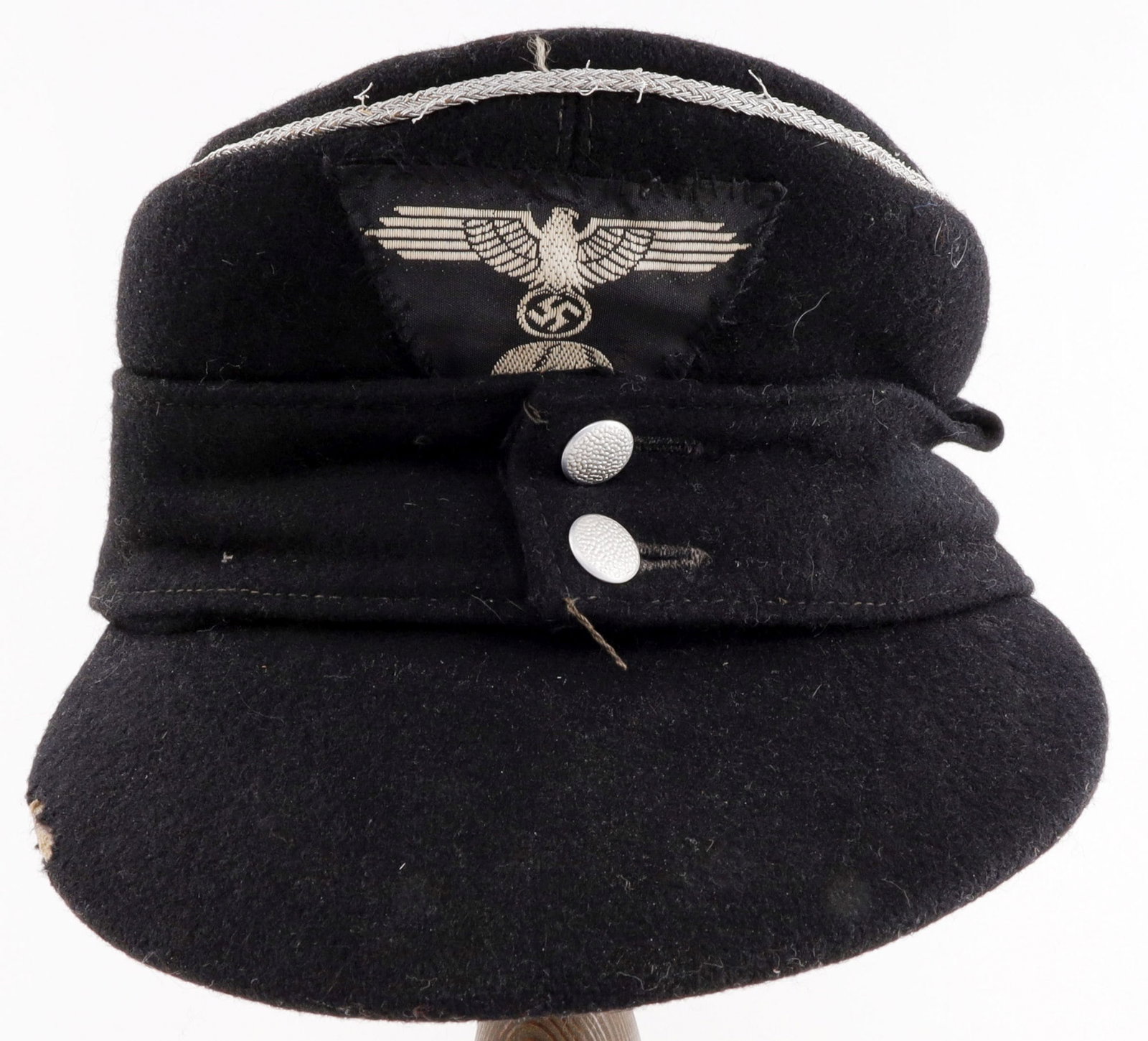 ALLGEMEINE-SS MODEL 43 FIELD CAP WWII GERMAN REICH: A model 1943 field cap for a member of the Allgemeine-SS. Maker's stamp Edmund Orth. The base cap is likely authentic to the Second World War; the patch on the front is a later addition or replacement