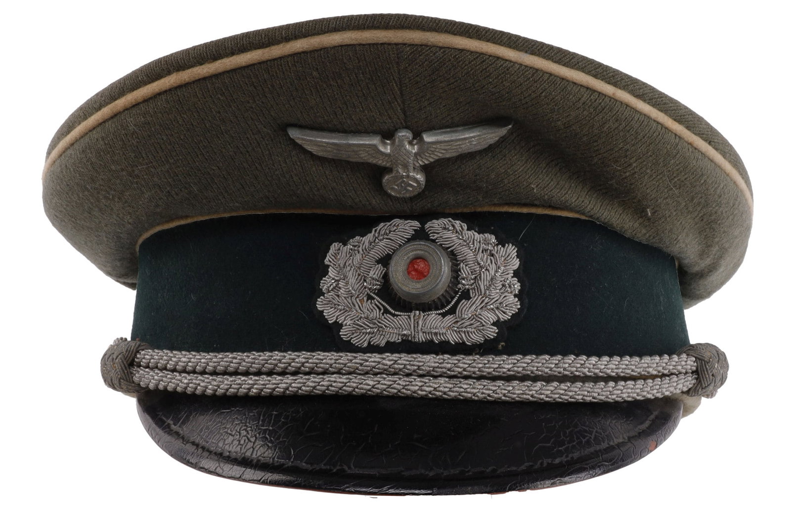 ARMY OFFICER VISOR CAP WWII GERMAN THIRD REICH: Field grey with white piping. Zinc eagle, aluminum cockade and chinstrap. Lining features name tag for Major Kissling. Leather sweat band has a few rips but the visor is in overall very good condition
