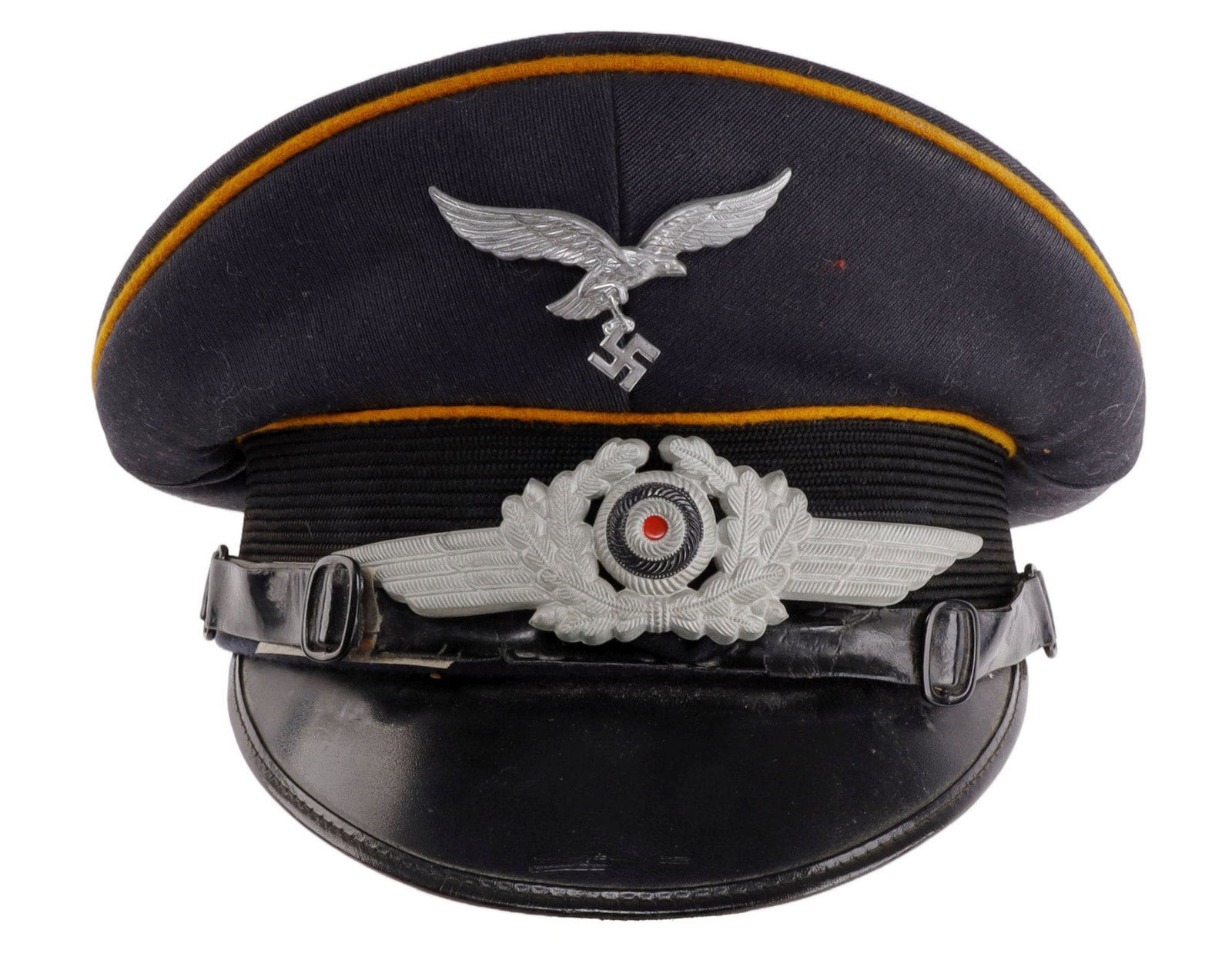 LUFTWAFFE FELDGENDARMERIE VISOR WWII GERMAN REICH: Blue visor with orange piping, aluminum eagle and cockade, silk lining and leather sweatband. Very good condition overall aside from sweatband. Interior diameter measures 6 7/8 inches. Visor is also s