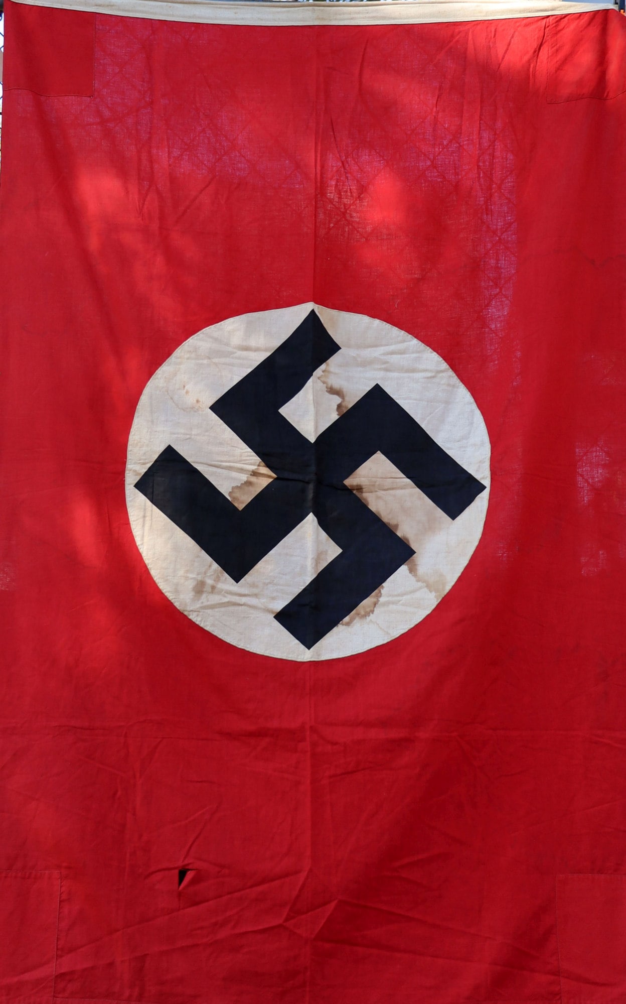 WWII GERMAN REICH NSDAP BANNER FLAG: Standard banner. Double sided cloth construction. It measures 70 X 45 inches. Non-fluorescing. From featured dealer John Fiske.
