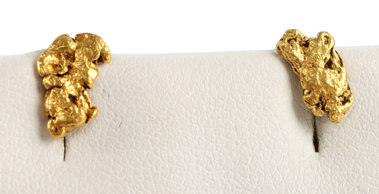 22K GOLD NATURAL ALASKA NUGGET EARRINGS 1.5 GRAMS: Two earrings, each sporting a gold nugget testing at least 22K. Mount is 14K. Nuggets are approximately 7mm. 1.5 grams combined weight. This lot reserved at melt.