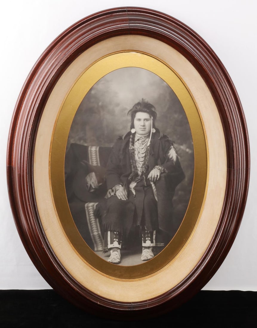 PHOTOGRAPH OF NATIVE AMERICAN INDIAN NEZ PERCE: Photographic portrait of a Native American Indian Man of the Nez Perce tribe, taken circa 1880 in Lapwai, Idaho. On back of photograph is text reading "Photograph of Nez Perce Indian Chief taken at La