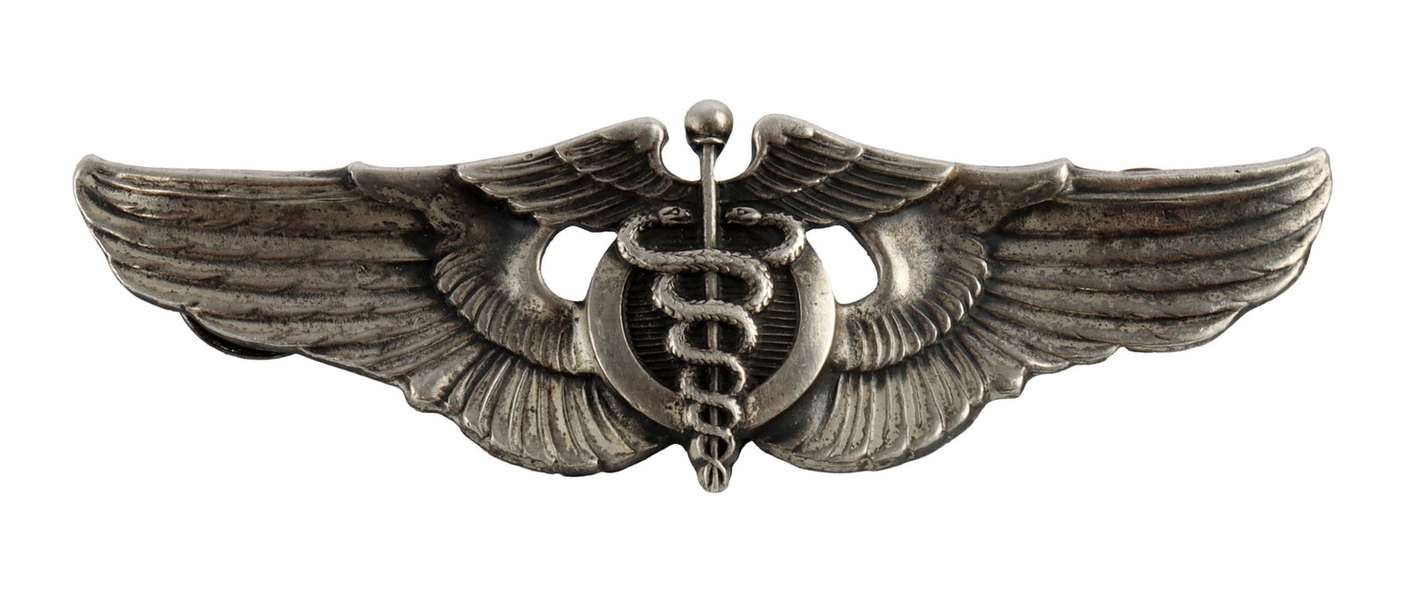 WWII USAAF FLIGHT SURGEON WINGS 3-1/8 INCH: US Army Air Forces Flight Surgeon's Wings. Marked "Sterling" on reverse. Pinch-back. Width 3-1/8 inches. Very good condition.