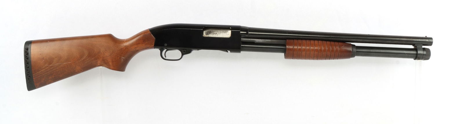 WINCHESTER MODEL 1300 DEFENDER 12 GAUGE SHOTGUN: Winchester Model 1300 Defender pump-action shotgun, 12 gauge, 3-inch chamber. Barrel length 18.5 inches. Full length magazine tube. Good condition. Mechanically fine, functions without issue. Bore is