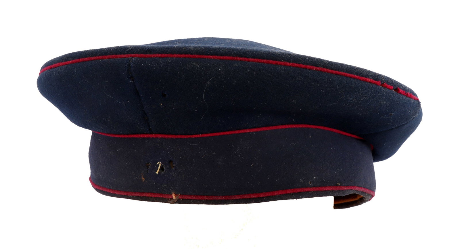 WWI IMPERIAL GERMAN UNIT MARKED BAVARIAN VISOR CAP: Of dark blue wool with maroon or red piping. Interior has imitation leather sweatband and liner of silk and buckram. Liner has ink stamp "16. F.W. 27.I." Good condition. Scattered mothing. Visor remov