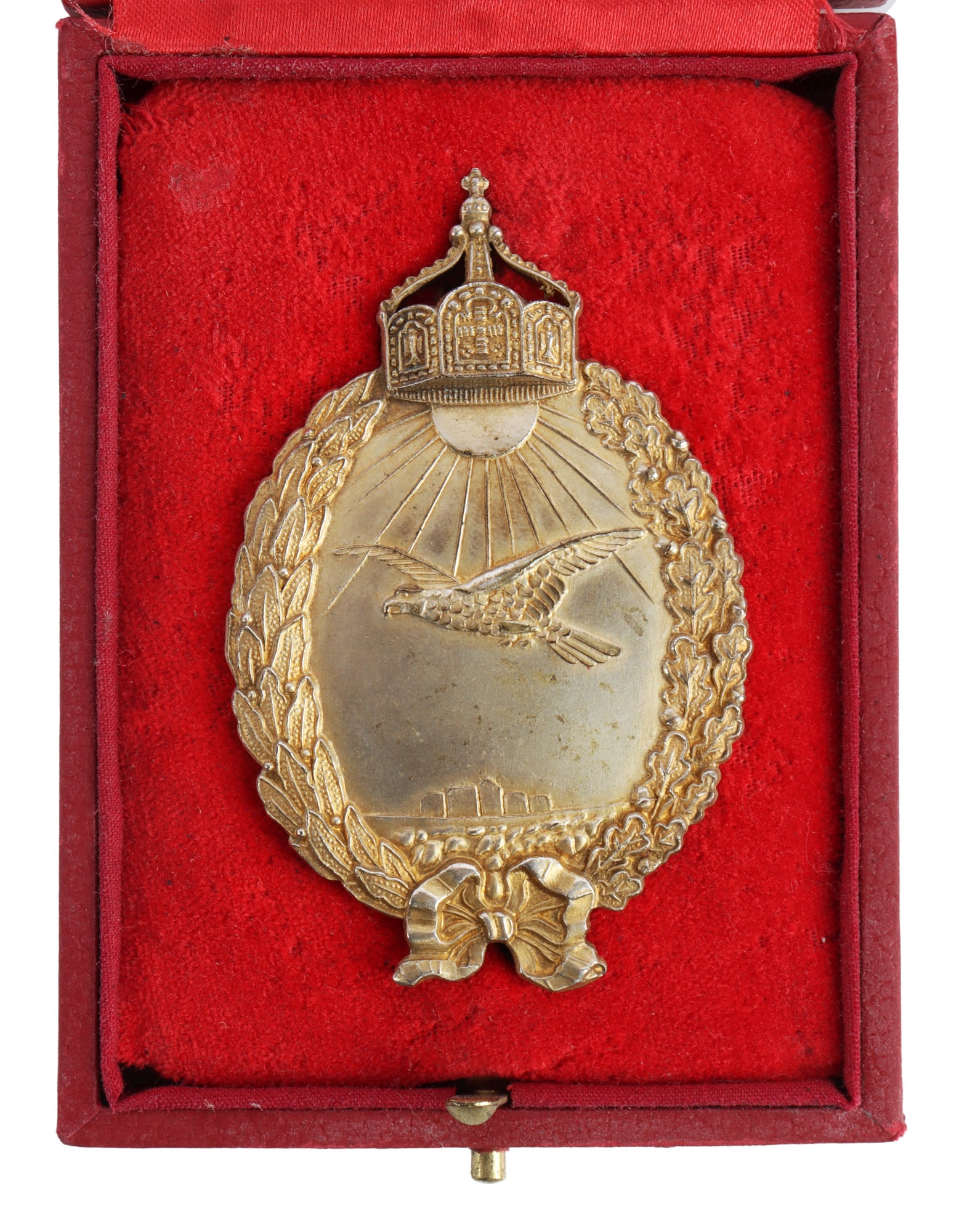 WWI IMPERIAL PRUSSIAN SEA PILOT BADGE: Brass gilt badge with oak and laurel leaf wreath and crown. H. Schaper make on reverse. It measures 2 5/8 inches. Comes in fitted case.