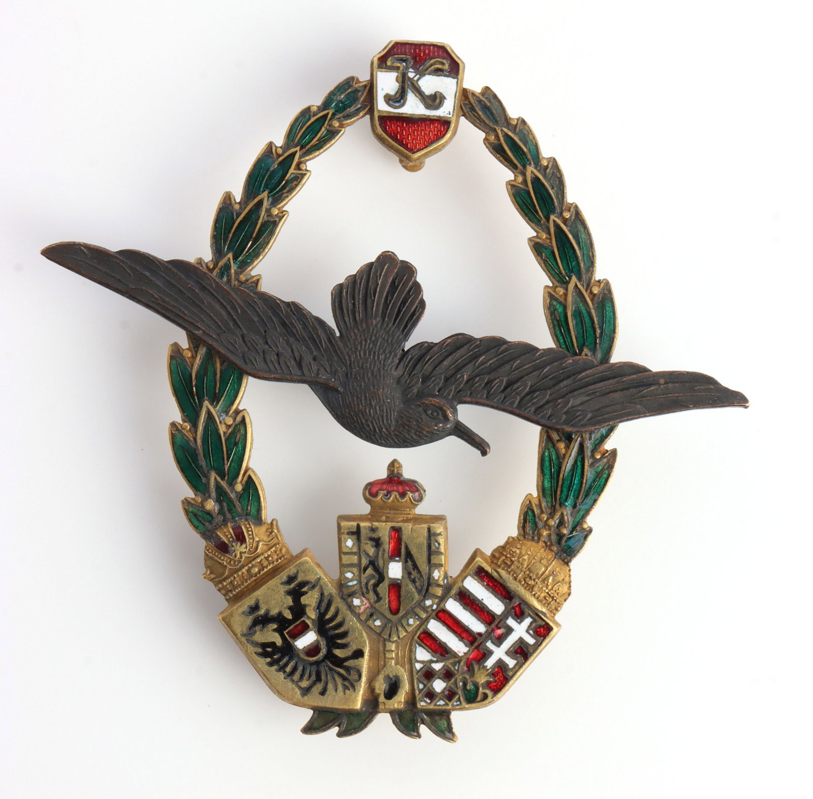 AUSTRIAN EMPIRE NAVAL PILOT BADGE: Kaiser Karl type badge with Zimbler Wein make. Brass construction with enamel. It measures 2 1/2 inches. Very good condition. This lot has a reserve.