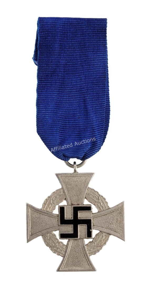 WWII GERMAN FAITHFUL SERVICE CROSS AND RIBBON: Black enamel swastika. Silver grade. It measures 2 inches. Very good condition. This lot has a reserve.