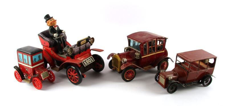 4 VINTAGE TOY CARS: Grouping consist of Japan tin battery toy 1901 carriage buggy car, Vintage 1950's tin automobile - Trade Mark modern toys-lever auction, 1915 miniature model Ford made in Japan and Old medal car with