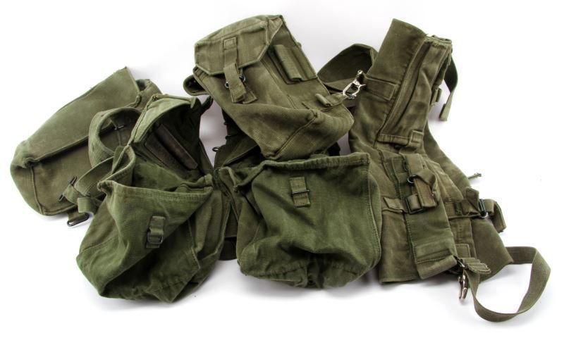 1985 BROAD ARROW MARKED WEB-BELT & HARNESS: Most markings are worn off, but visible on the belt and harness one of the five bags attached to the web-belt is marked with "CWE 1985" and a Broad Arrow. Web gear is in good condition showing some we