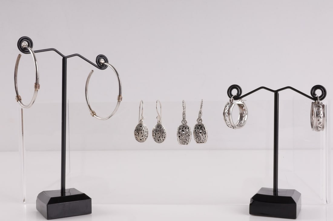 STERLING SILVER EARRINGS LOT OF FOUR PAIRS: Four (4) pairs of sterling silver earrings. Set includes two pairs of hoops and two pairs of dangles. All earrings are in very good condition. This lot has a reserve.