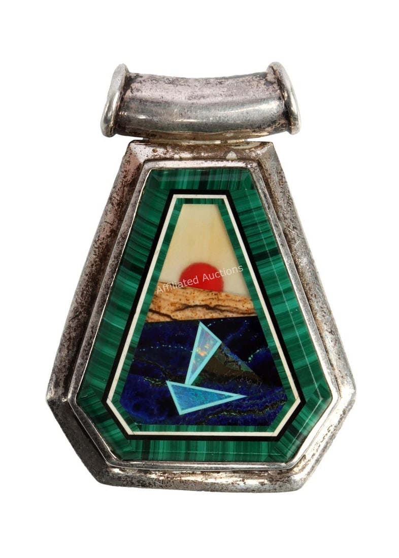 UNIQUE INLAY STONE PENDANT SET IN SILVER: A silver pendant with inlay stones, arrayed in a geometric pattern. 2 inches. This lot has a reserve.