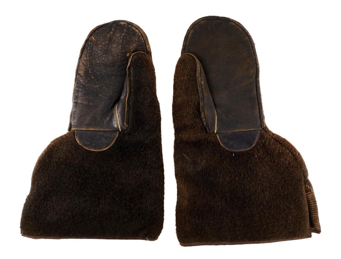 US OLD WEST BISON FUR MITTEN GLOVES: A pair of bison fur mittens for cold weather work. Probably early 20th century. Medium size. Some wearing of the fur. Corduroy style lining. Very good, original condition.
