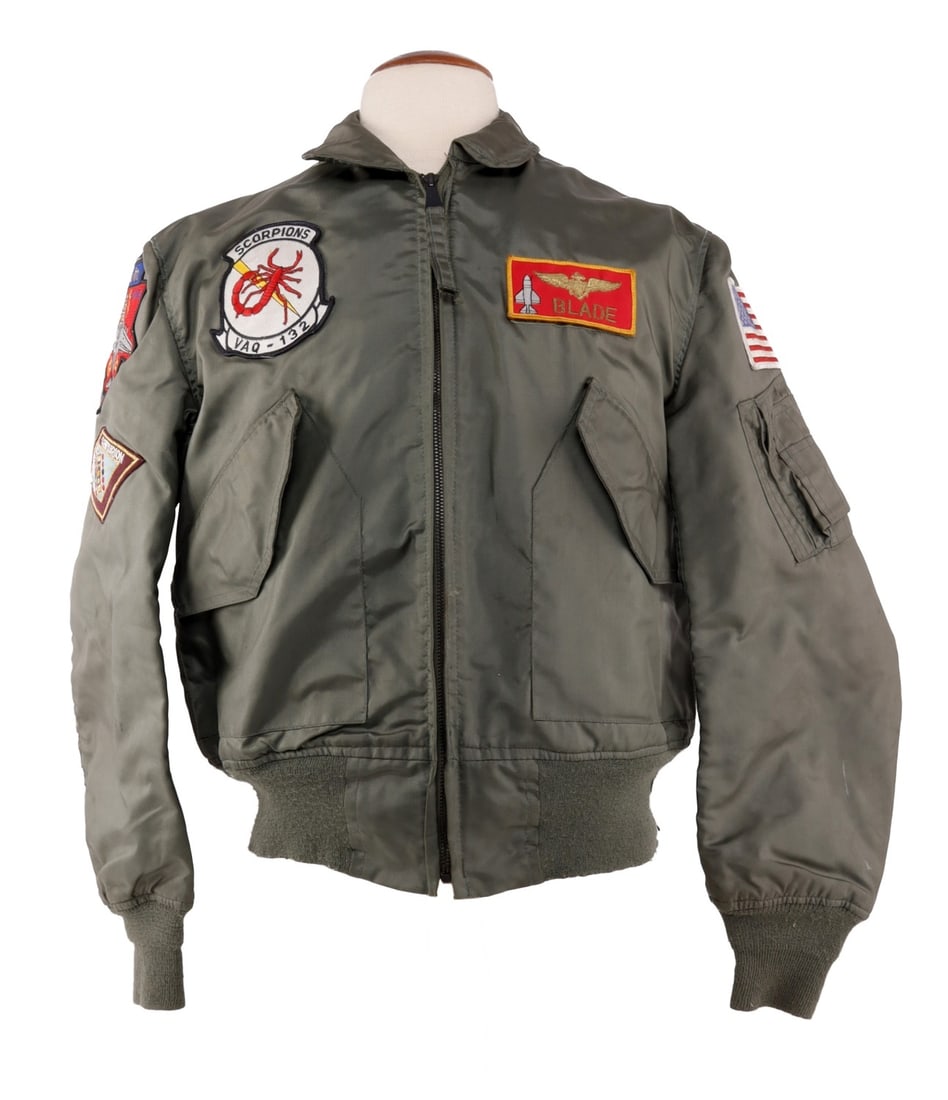 US NAVY VAQ-132 PILOT FLIGHT JACKET CWU-36/P: Medium size. Features a variety of patches with naval aviator name tag Blade. Other patches featured are Forrestal Centurion, Prowler EA-68, and US flag patch.