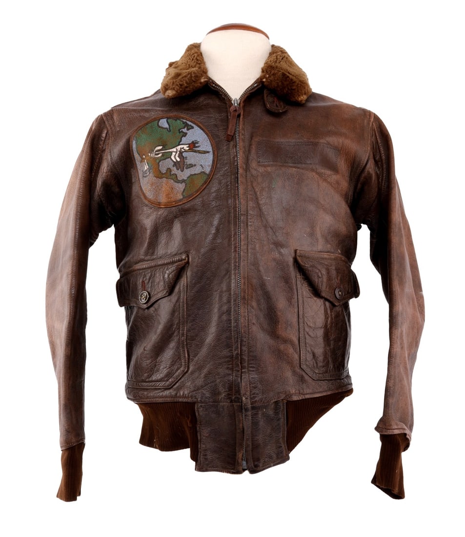WWII US NAVY PILOT M422 G-1 PILOT'S FLIGHT JACKET: Leather flight jacket with brown fur collar. Tag near collar from Willis and Geiger. No name tag featured. Patch on right breast is a VRF-1 Ferry Squadron patch. Size 38. Overall very good condition b
