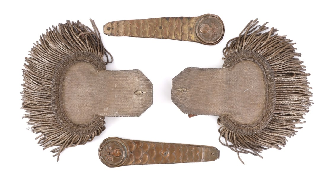 FRENCH M1845 SILVER EPAULETTES & SCALED CHINSTRAPS: Lot of four (4) pieces. Includes pair of silver bullion wire epaulettes of a superior officer and pair of scaled chinstraps with flaming bomb insignia. Very good condition. Epaulettes are without butt