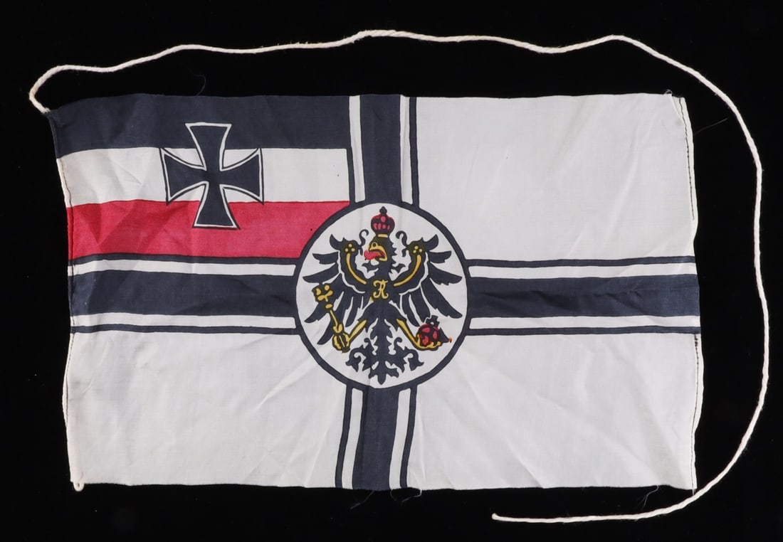 WWI IMPERIAL GERMAN SMALL SILK REICHSKRIEGSFLAGGE: Original Imperial War Flag of silk of the type used for patriotic desk ornament flagpoles. Measures 7 x 11 inches. Retains long twine hoist. Very good condition.