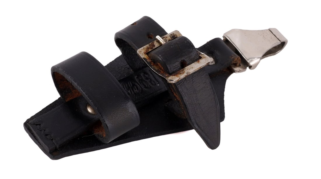 WWII GERMAN SS DAGGER VERTICAL HANGER: Vertical dagger hanger of black leather and nickel-plated steel. Top clip marked "RZM M5/8." Leather stamped "RZM 421/39 S." Very good condition.