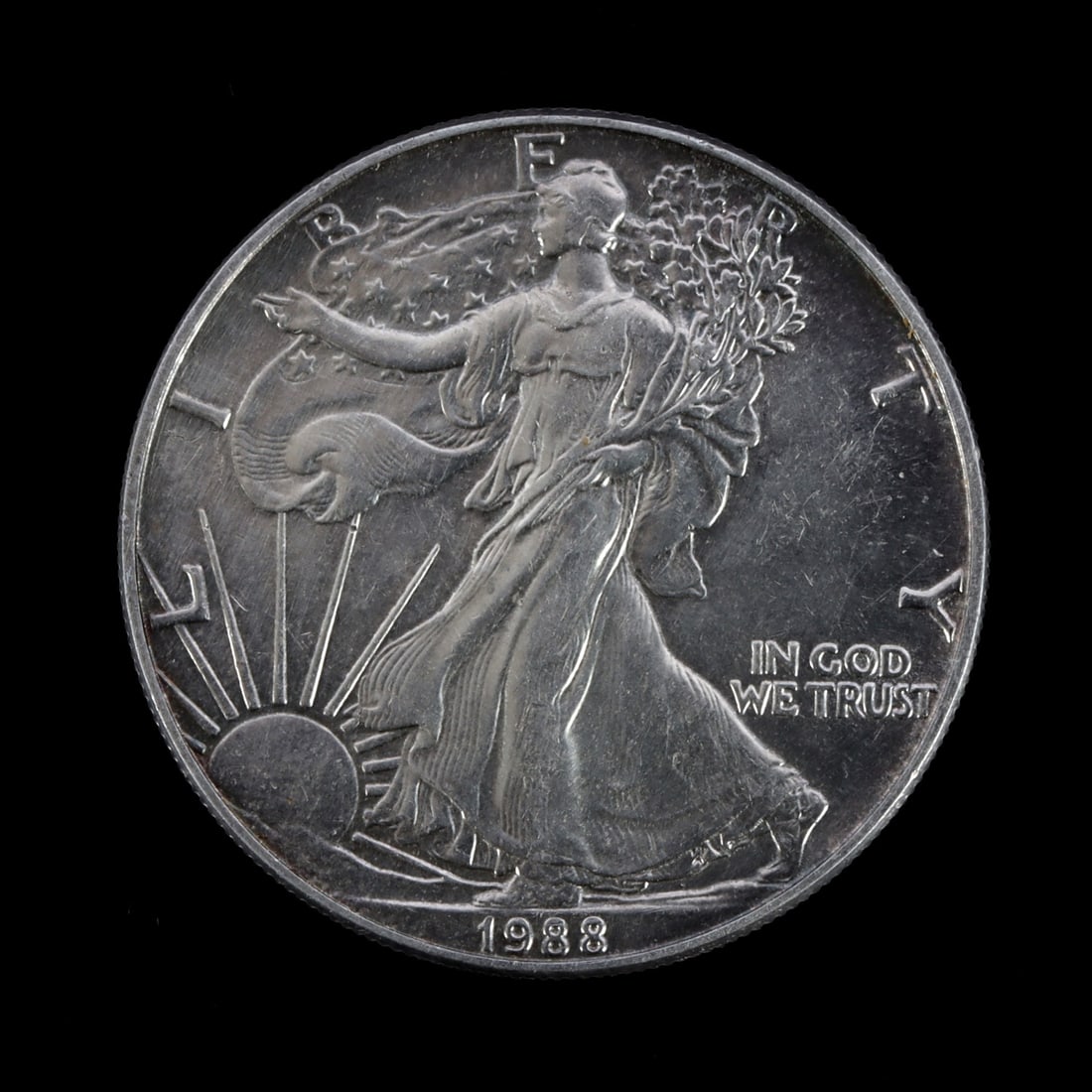 US SILVER EAGLE WALKING LIBERTY 1 OZT FINE SILVER: Some toning. Brilliant uncirculated. This lot reserved at melt.