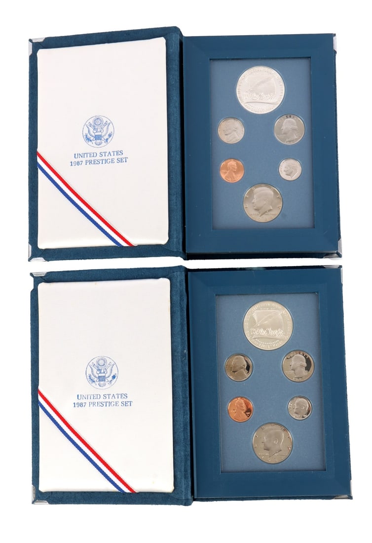 US SILVER DOLLAR 1987 PRESTIGE SET LOT OF 2: Brilliant uncirculated, mint state with a certificate of authenticity. This lot reserved at melt.