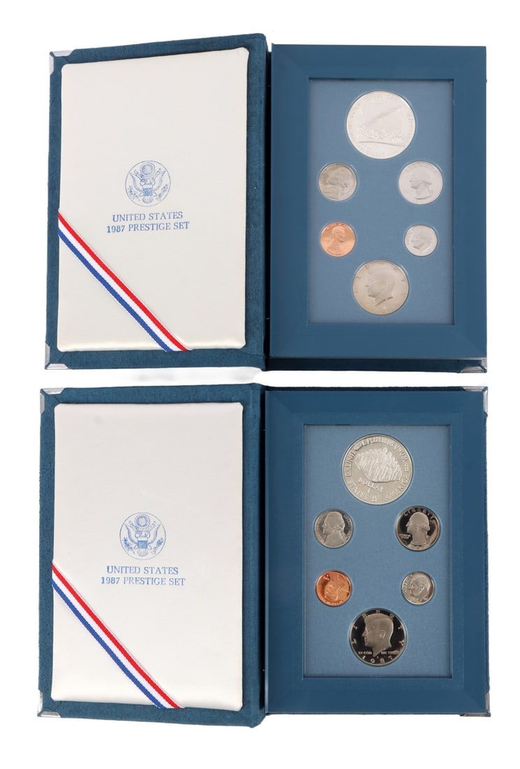US SILVER DOLLAR 1987 PRESTIGE SET LOT OF 2: Brilliant uncirculated, mint state with a certificate of authenticity. This lot reserved at melt.