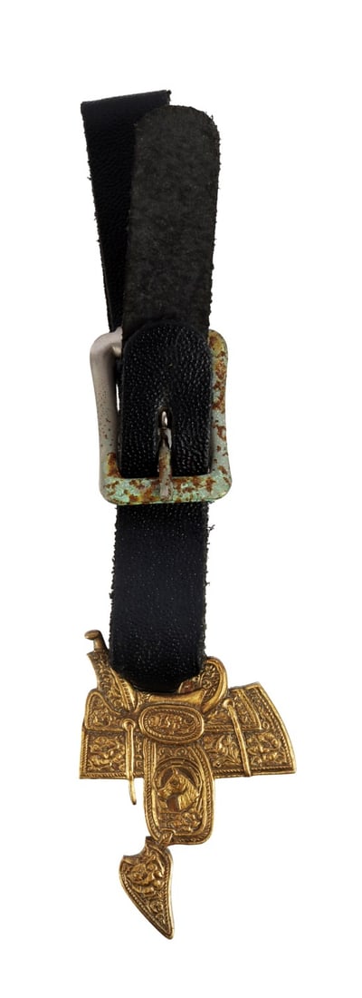 ANTIQUE SADDLE FOB G S GARCIA ELKO NEVADA: An antique saddle fob made by G. S. Garcia of Elko, Nevada. Mounted on a leather strap, buckle on leather strap shows oxidation. The fob itself has strong features, minimal wear, and no oxidation. Ver