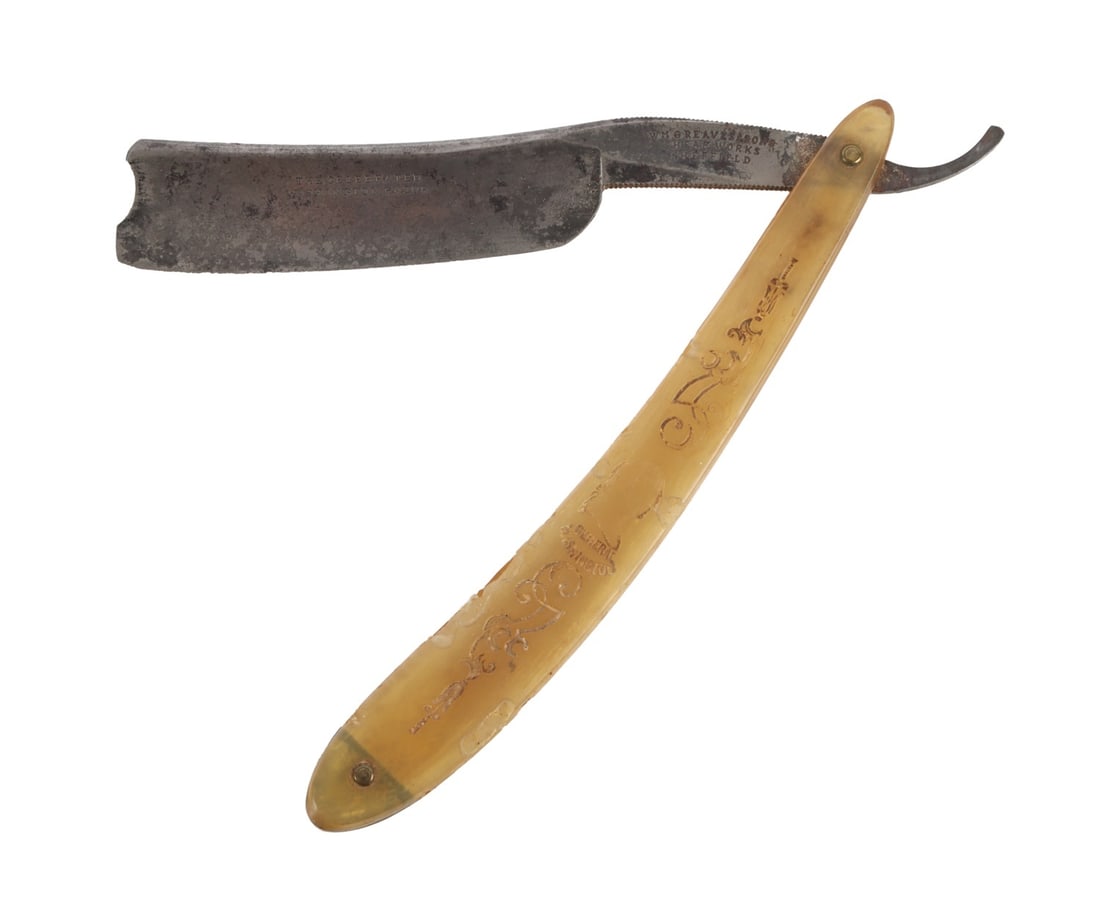 ANTIQUE STRAIGHT RAZOR CELEBRATED WASHINGTON: An antique straight razor with the slogan 'The Celebrated Washington Razor' embossed on to the blade. Maker's mark from William Greaves & Sons of Sheffield. Approximately 6 inches when folded.