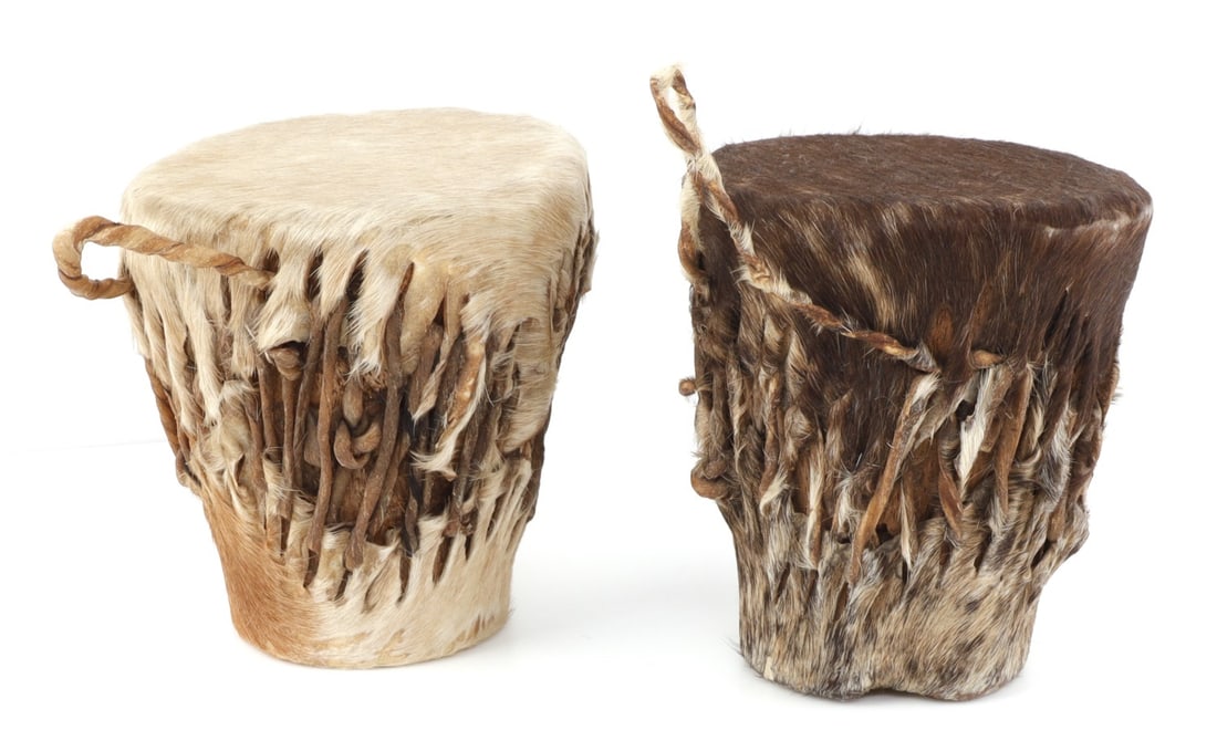 TANZANIAN COW OR CAMEL HIDE DRUMS LOT OF 2: Two African cow or camel hide drums, matching ones commonly found in Tanzania. 4.25 inches tall. Very good, original condition.