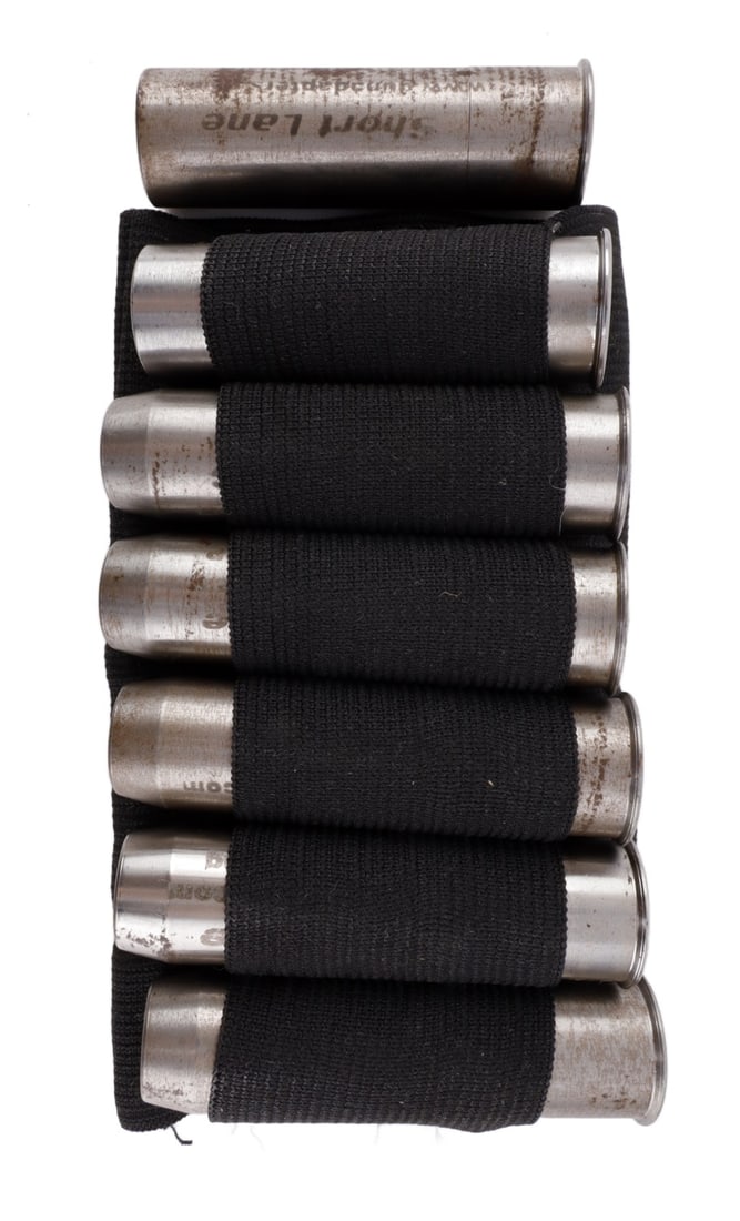 SHORT LANE 12 GA CALIBER CONVERSION ADAPTER SET: Lot of seven (7) Short Lane caliber conversion adapters. Includes adapters for converting a 12 gauge to 20 gauge (2.75 inch), 410/45 LC, 45 ACP, 44 Magnum, 38 Special, 9mm Luger and 22 LR (3 inch). Go