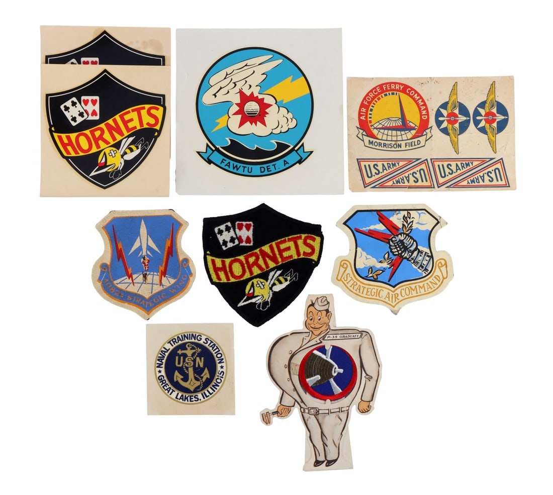 LOT OF US MILITARY PATCHES AND DECALS: Lot features Hornets decals and patches, FAWTU DET. A weather training decal, and more. Very good condition.