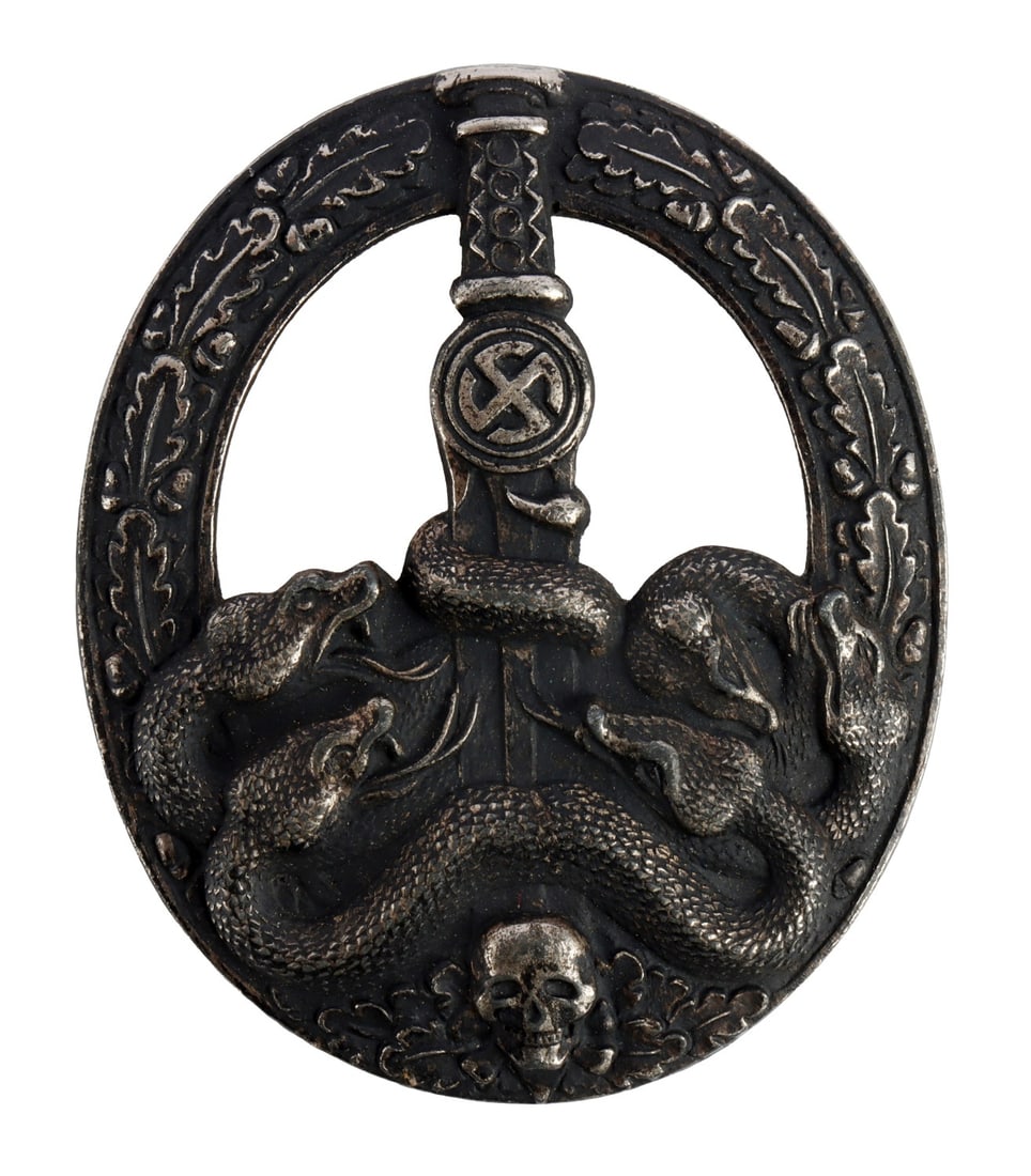 GERMAN SOUVAL ANTI-PARTISAN BADGE IN SILVER: Souval post-war Anti-Partisan Badge. Solid-struck, non-ferrous construction. Reverse has vertical thin wire pin and flat sheet metal catch, mounted on plate. No maker's mark. Height 2-3/8 inches. Widt