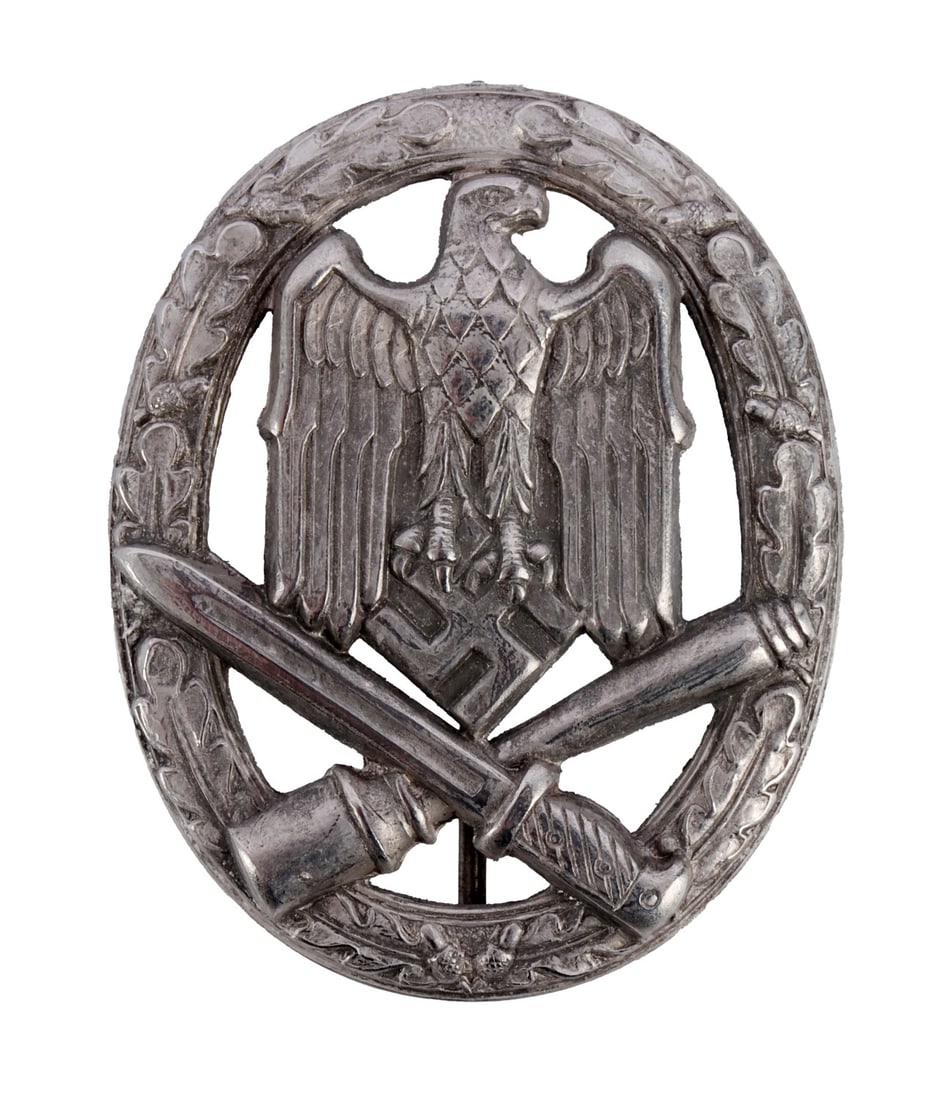 WWII GERMAN GENERAL ASSAULT BADGE: General Assault Badge (Allgemeines Sturmabzeichen). Classic hollow-back stamped type. It measures 2 inches. This lot has a reserve.