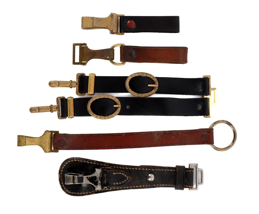 WWII GERMAN DAGGER HANGER PARTS LOT OF 5: Lot of five (5) dagger hanger components. Includes pair with brown leather webbing and pebbled gold clips marked "RZM UE 97." Black leather webbing with gold clip marked "RZM M5/230." Unauthenticated,