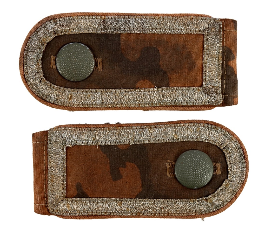 WWII GERMAN THIRD REICH DAK CAMO SHOULDER PATCHES: A pair of DAK (German Afrika Korps) camo shoulder patches from the German Third Reich. Non-fluorescing, pebbled metal button and silver bullion thread frame. Very good, original condition.