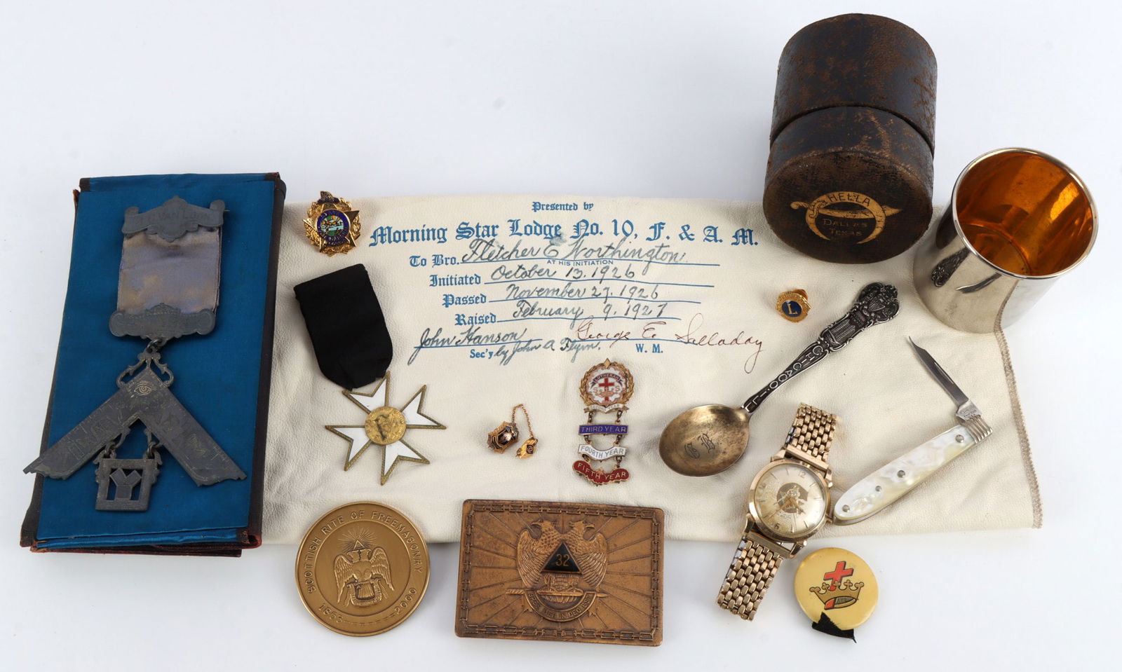 COLLECTION OF FRATERNAL ITEMS FREE MASONRY: An assembled lot of various items associated with fraternal organizations. Pins, watches, aprons, and other items. Most of the items are associated with Freemasonry. Very good, original condition. Thi